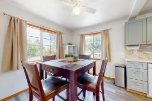 a kitchen with a dining room table and chairs at Wonder on Whiskey Road in Warrenton