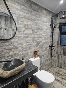 a bathroom with a sink and a toilet at Zarevo Glamping in Skobelevo