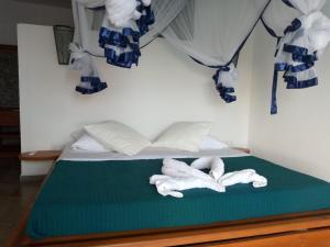 Ένα ή περισσότερα κρεβάτια σε δωμάτιο στο La Résidence Tiako +11 φωτογραφίες