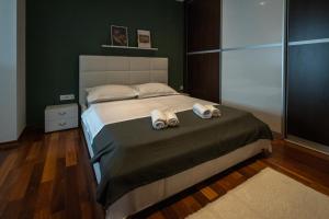 Posteľ alebo postele v izbe v ubytovaní Lumaja luxury apartman
