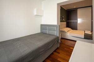 Posteľ alebo postele v izbe v ubytovaní Lumaja luxury apartman