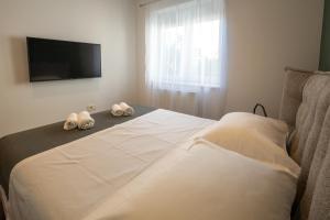 Posteľ alebo postele v izbe v ubytovaní Lumaja luxury apartman