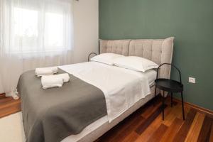 Posteľ alebo postele v izbe v ubytovaní Lumaja luxury apartman