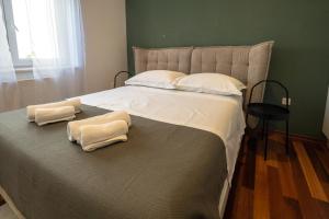 Posteľ alebo postele v izbe v ubytovaní Lumaja luxury apartman