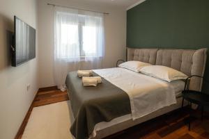 Posteľ alebo postele v izbe v ubytovaní Lumaja luxury apartman