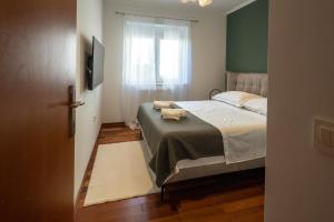 Posteľ alebo postele v izbe v ubytovaní Lumaja luxury apartman