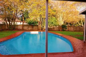 a swimming pool in a yard at Prosam Guesthouse Inn in New Germany