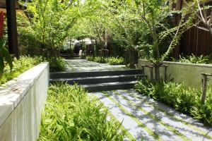 a garden with stairs and plants at Avatar Railay in Railay Beach