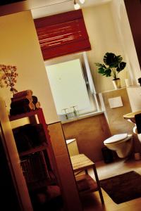 a living room with a window and a book shelf at 3,5 Zimmer Wohnung nahe Legoland in Neuburg an der Kammel