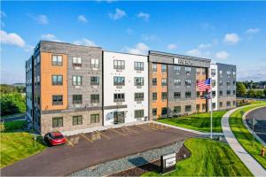 an apartment building with a car parked in front of it at Fairway in Altoona
