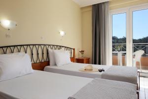 Postel nebo postele na pokoji v ubytování Kavos Plaza Hotel + 37 fotografií