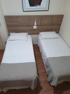 Cama ou camas em um quarto em Via Contorno Hotel