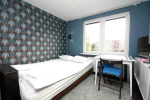 Cama ou camas em um quarto em Pomorskie Apartamenty Mazurska