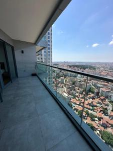 a balcony in a building with a view of a city at Luxury 1+1 apt in Sinpaş Queen Bomonti in Istanbul