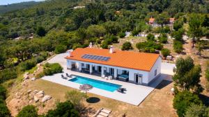 an aerial view of a house with a swimming pool at Luar do Algarve in Monchique