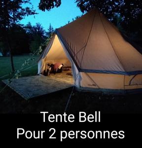 a tent bell with two people inside of it at Dordogne Glamping in Bouzic