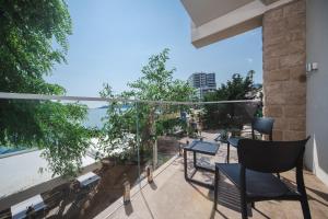 a balcony with a view of the ocean at Boutique Hotel Shell in Budva