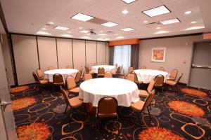 a conference room with tables and chairs in it at Hampton Inn & Suites Albany at Albany Mall in Albany
