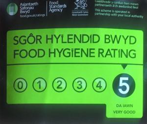 a sign that says seafood hyundai hybrid food hygiene rating at Bumbleberry Cottage in Gresford