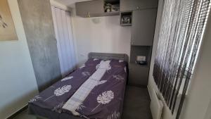 Postel nebo postele na pokoji v ubytování HT Apartman