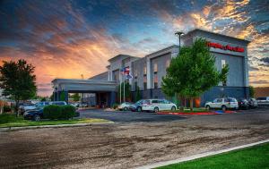 a building with cars parked in a parking lot at Hampton Inn and Suites Amarillo West in Amarillo