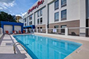 a swimming pool in front of a hotel at Hampton Inn Anderson in Anderson