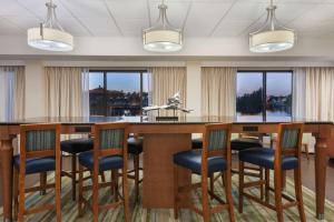 a conference room with a large table and chairs at Hampton Inn Bonita Springs Naples North in Bonita Springs