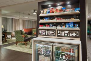 a store with a display of food on a shelf at Hampton Inn Bonita Springs Naples North in Bonita Springs