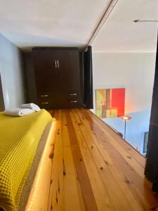 a bedroom with a bed and a wooden floor at Abbasaga, Besiktas in Istanbul