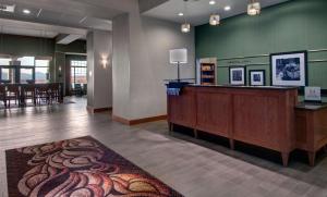 a lobby with a reception desk and a waiting area at Hampton Inn & Suites Astoria in Astoria, Oregon