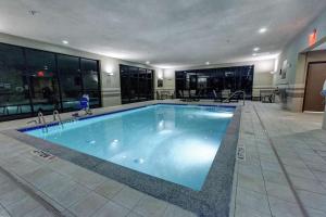 a large swimming pool in a building at Hampton Inn Neptune in Neptune City