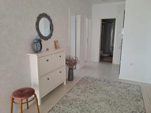 a room with a white dresser and a mirror at La Mar in Pag