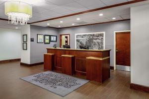 a lobby with a reception desk in a building at Hampton Inn Atlanta-Fairburn in Fairburn