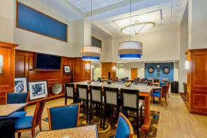 a dining room with a large table and chairs at Hampton Inn & Suites Atlanta-Six Flags in Lithia Springs