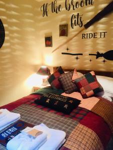 a bedroom with a bed with the words if the room fitsride it at Bumbleberry Cottage in Gresford