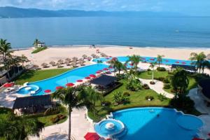 an aerial view of a resort with a beach at Grand Venetian - Zen oceanview condo in hotel zone in Puerto Vallarta