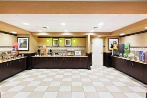 a lobby of a hotel with a coffee shop at Hampton Inn and Suites Austin - Lakeway in Lakeway