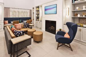 a living room with a couch and a fireplace at Hampton Inn & Suites Lanett/West Point in Lanett