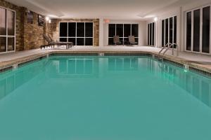 a swimming pool with blue water in a house at Hampton Inn & Suites Lanett/West Point in Lanett