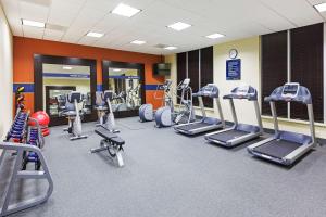 a gym with several treadmills and cardio machines at Hampton Inn Austin Oak Hill in Austin