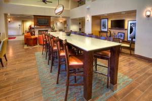 a large dining room with a large table and chairs at Hampton Inn & Suites Altus in Altus