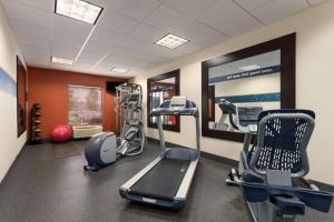 a gym with treadmills and ellipticals in a room at Hampton Inn Belle Vernon in Belle Vernon