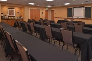 a conference room with black tables and chairs at Hampton Inn and Suites Bakersfield North-Airport in Bakersfield +22 photos