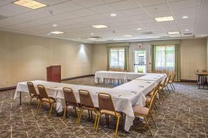 a conference room with a long table and chairs at Homewood Suites Bakersfield in Bakersfield