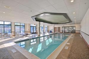 a large swimming pool in a building at Homewood Suites Boston Peabody in Peabody