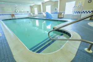 a large swimming pool with blue water at Hampton Inn Batavia in Batavia