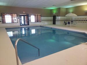 a large swimming pool in a building at Hampton Inn East Aurora in East Aurora