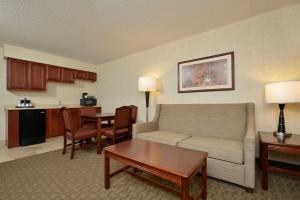 a living room with a couch and a table at Hampton Inn East Aurora in East Aurora