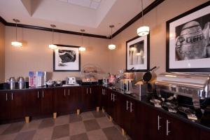 a coffee shop with a counter in a room at Hampton Inn Buffalo-South/I-90 in West Seneca
