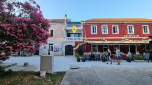a group of people standing in front of a building at Ivory Apartment in Biograd na Moru